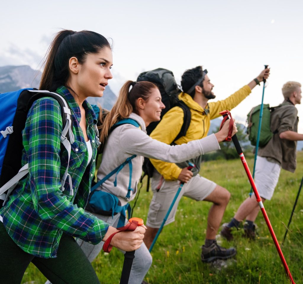 group-of-friends-trekking-with-backpacks-walking-in-the-forest-1.jpg